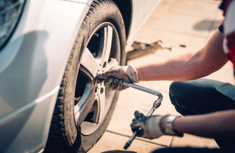 Replacing tire of a vehicle by a mechanic