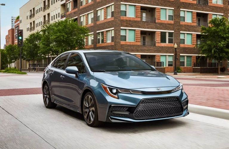 2022 Toyota Corolla backdropped by a building